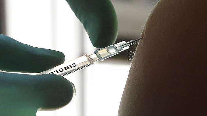 A young woman gets vaccinated with the Johnson & Johnson