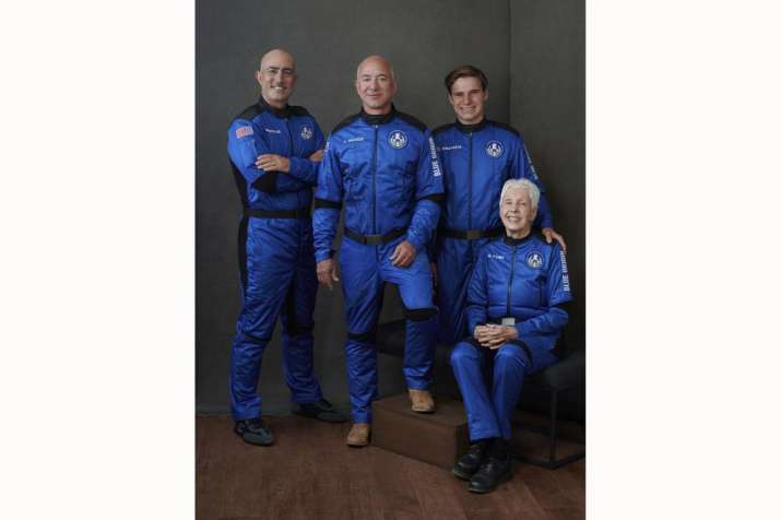 India Tv - In this photo provided by Blue Origin, from left to right: Mark Bezos, brother of Jeff Bezos; Jeff Bezos, founder of Amazon and space tourism company Blue Origin; Oliver Daemen, of the Netherlands; and Wally Funk, aviation pioneer from Texas, pose for a photo.