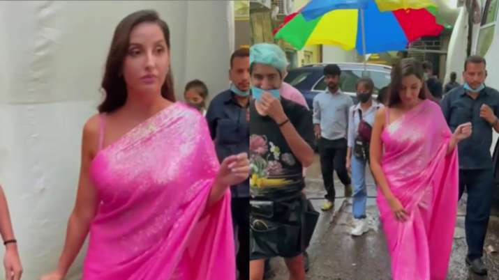 Nora Fatehi walks around in pink saree amid Mumbai rains; Netizen troll her and ask 'mask kahan hain