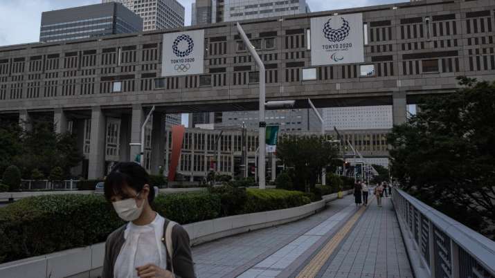 Tokyo's drinkers drown frustrations over virus limits, Games