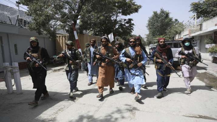 Taliban fighters patrol in the Wazir Akbar Khan
