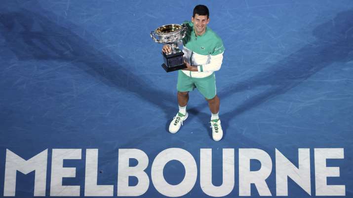 India Tv - In this Feb. 21, 2021, file photo, Serbia's Novak Djokovic holds the Norman Brookes Challenge Cup after defeating Russia's Daniil Medvedev in the men's singles final at the Australian Open tennis championship in Melbourne