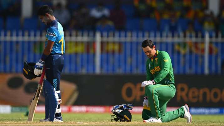 Quinton De Kock of South Africa takes the knee ahead of the