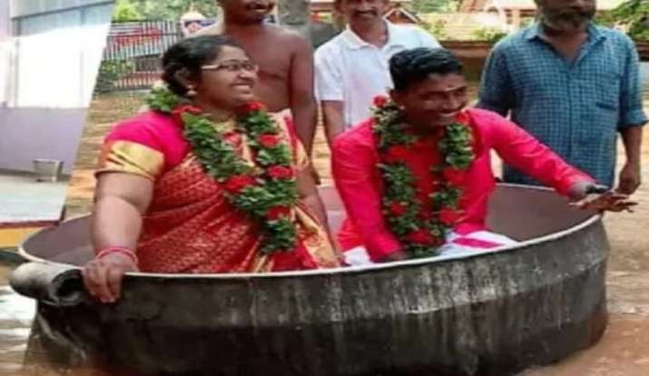 Monsoon Wedding! In Kerala, the bride and groom arrive in the hall filled  with cooking utensils for the wedding - Bharat Times English News