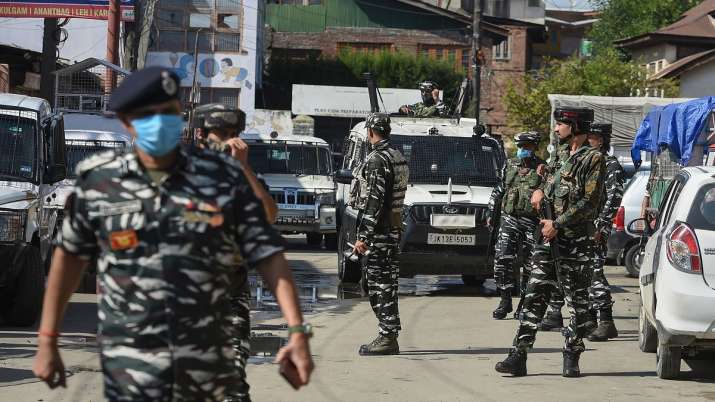 Senior security officers examine the area after a terrorist