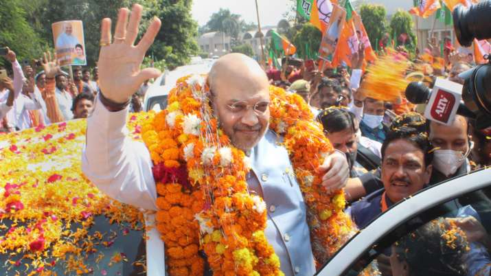Union Home Minister Amit Shah is garlanded by party