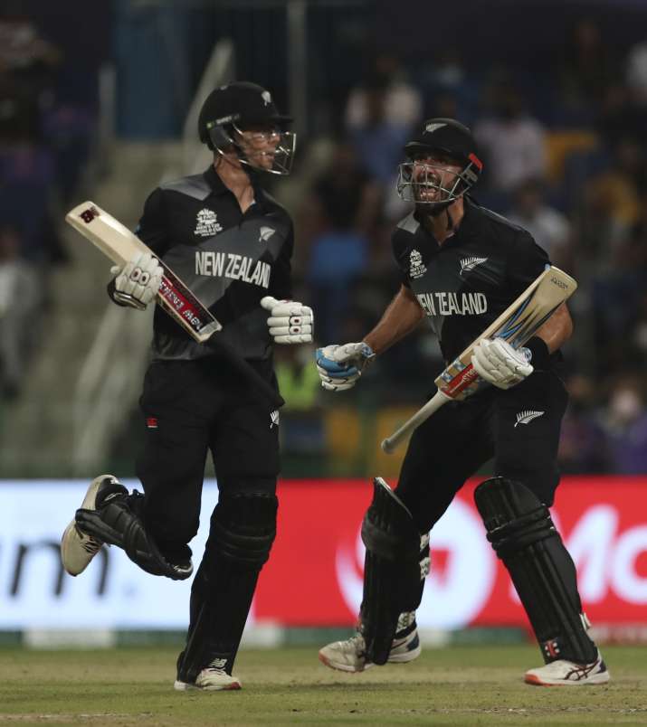 India Tv - New Zealand's Daryl Mitchell, right, and Mitchell Santner celebrate winning the Cricket Twenty20 Wor