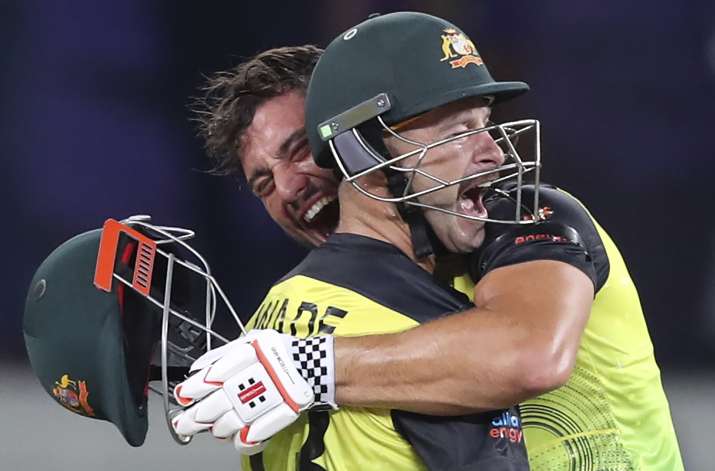 India Tv - Australia's Marcus Stoinis, holding helmet, and Matthew Wade celebrate after winning the Cricket Twe