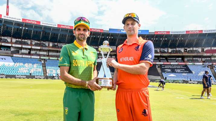 Captains Keshav Maharaj of South Africa and Pieter Seelaar of Netherlands pose with the series troph