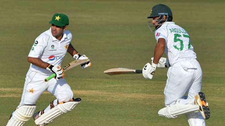 Pakistan's Abid Ali (left) and Abdullah Shafique run between the wickets on the fourth day of the fi