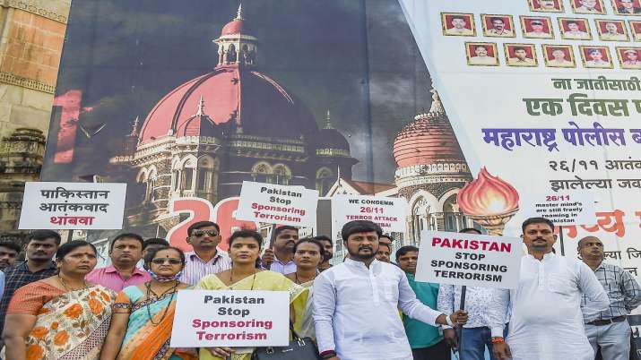 Members of Police Charitable Trust hold placards at the