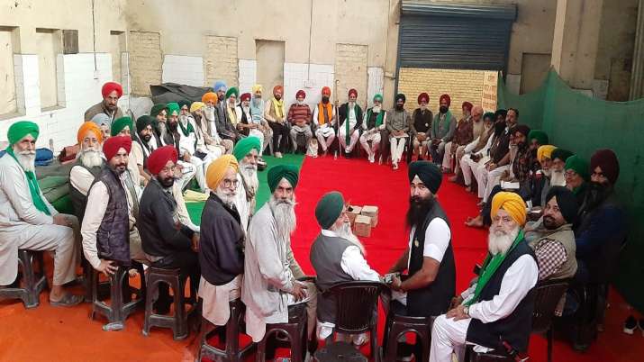 Farmers from different unions at a crucial meeting.