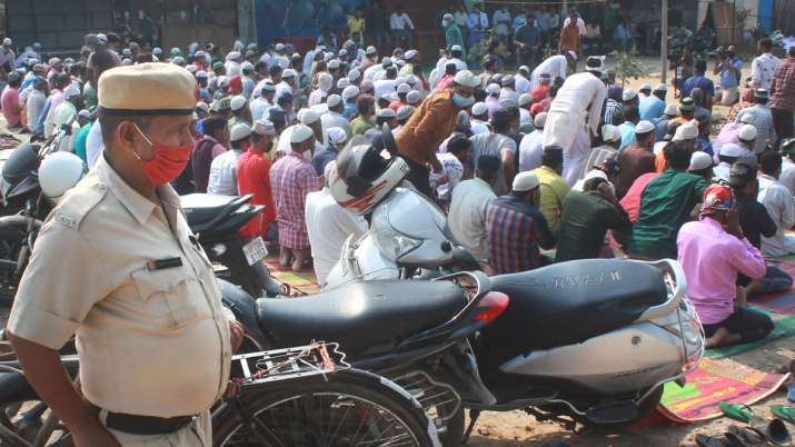 Muslims conduct Namaz at an open site amid heavy police