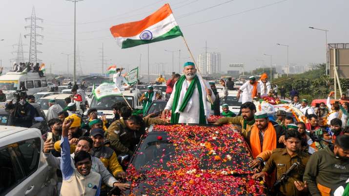 BKU spokesperson Rakesh Tikait prepares to leave after