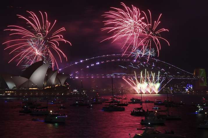 Fireworks explode over Sydney Opera House and Harbor
