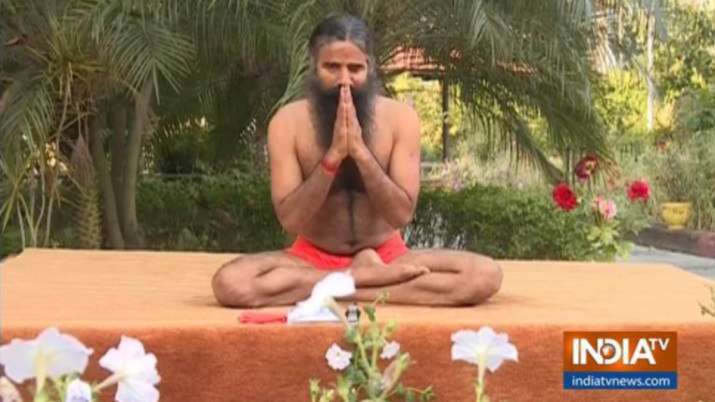 Omicron Scare Swami Ramdev fight new variant of COVID yoga ayurveda naturopathy latest health news - Vimarsana News