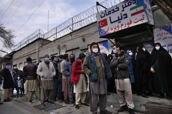 India Tv - Afghans lineup outside the Iranian embassy, ​​to apply for avisa, in Kabul, Afghanistan.