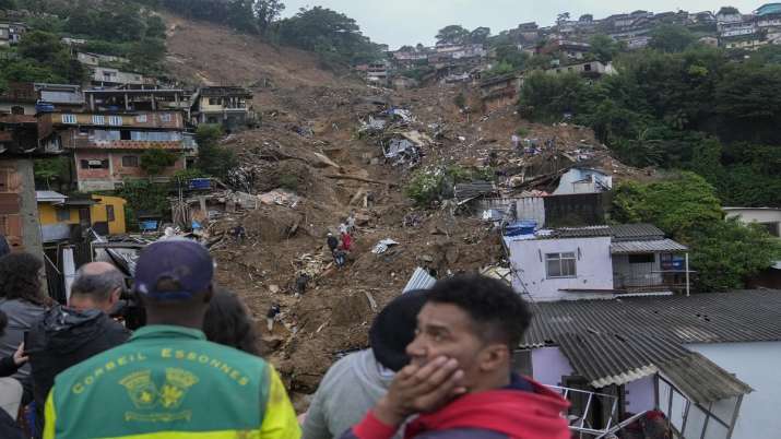 India Tv - Rescue workers and residents look for victims in an area affected by landslides in Petropolis, Brazil, Wednesday, Feb 16, 2022.
India Tv - mudslides in brazil, floods in brazil, Death toll rises IN BRAZIL, storm in Brazil, latest internati