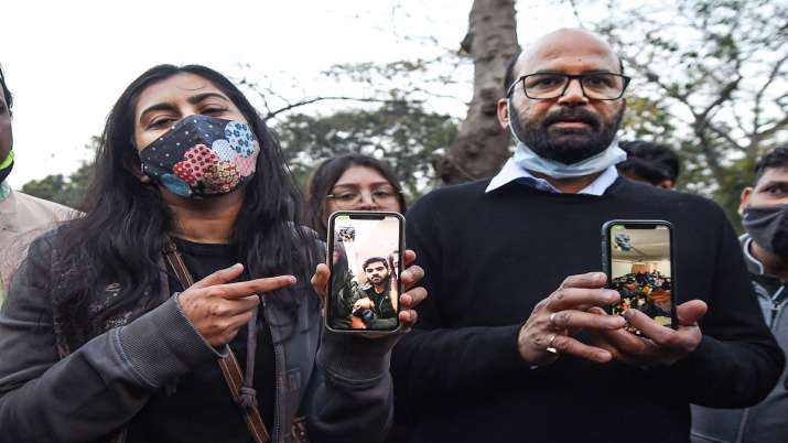 India Tv - Family members of students stranded in crisis-hit Ukraine display their photographs on mobile phones during a protest near the Embassy of the Russian Federation amid the Ukraine-Russia conflict, in New Delhi. 
