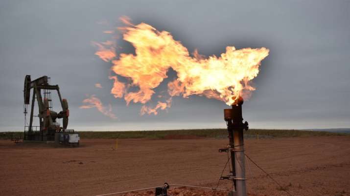 India Tv - A flare burns natural gas at an oil well Aug. 26, 2021, in Watford City, N.D. Consumers of natural gas are facing the prospect of much higher heating bills this winter. The U.S. has pledged to help maintain Europe's energy supply by boosting exports of liquefied natural gas, or LNG, if Russia were to invade Ukraine and reduce its gas shipments to the European Union. 