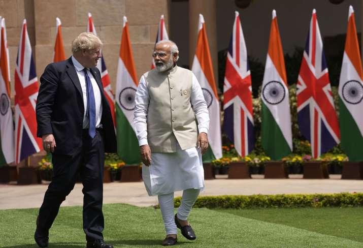 India Tv - Prime Minister Narendra Modi and his British counterpart Boris Johnson walk in for delegation level talks in New Delhi