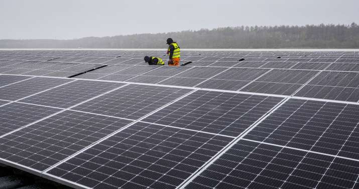 Solar panels are installed at a floating photovoltaic plant
