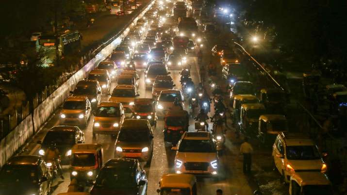 India Tv - Vehicles move slowly during a traffic jam, after a thunderstorm, at Majnu ka Tilla in New Delhi 