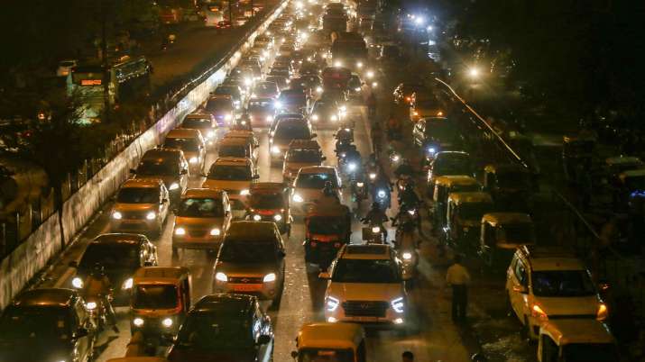 India Tv - At Majnu Ka Tila in New Delhi, vehicles move slowly during a traffic jam after a thunderstorm 