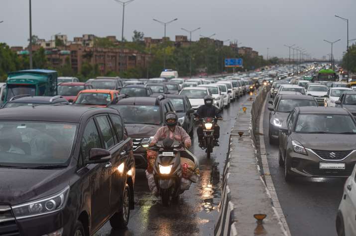 Heavy rain brings down temperature; but leads to traffic snarls, waterlogging across Delhi-NCR | PICS