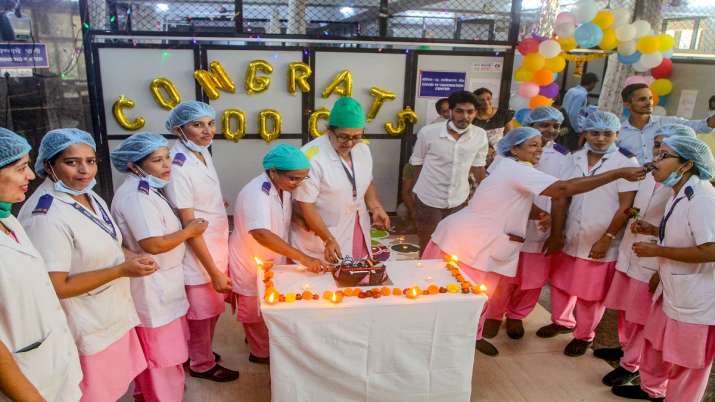 India Tv - Mumbai: Doctors and nurses celebrate as India crosses the mark of 100 crore Covid-19 vaccine doses, at Dr.  Baba Saheb Ambedkar Hospital in Kandivali, Mumbai, Thursday, Oct.21, 2021.  