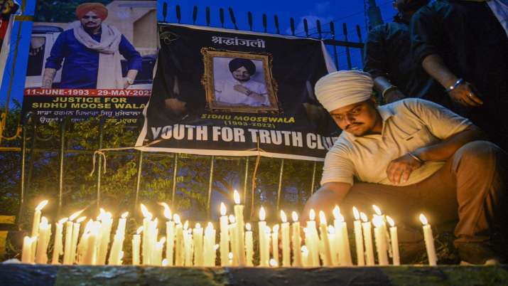 Youth during candle march to pay tribute