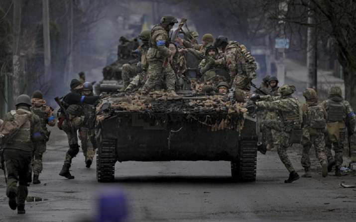 India Tv - FILE - Ukrainian servicemen climb on a fighting vehicle outside Kyiv, Ukraine, April 2, 2022. 