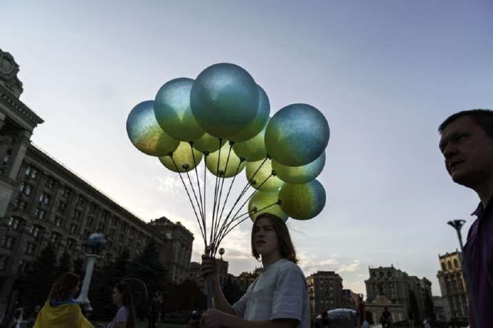 India Tv - A vendor sells blue and yellow balloons in honor of the country's National Flag Day, Tuesday, Aug. 23, 2022, at Maidan Square in Kyiv, Ukraine.