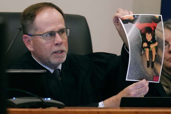 India Tv - Superior Court Justice Charles Temple holds a photograph of Elijah Lewis as he explains his sentence