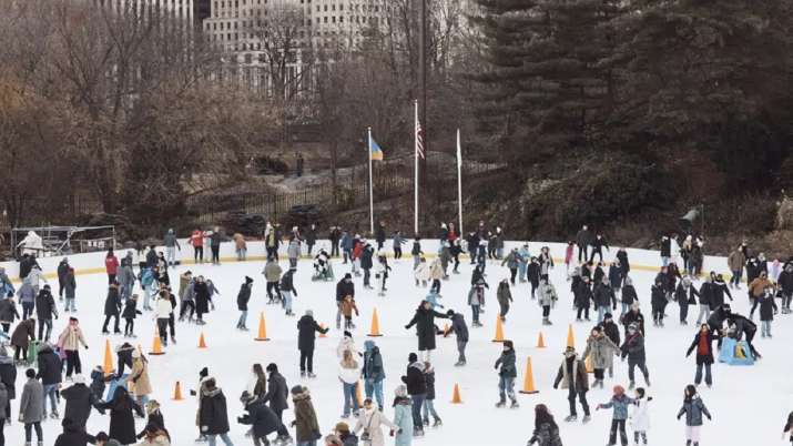India Tv - People ice skate on Christmas Day at Central Park in New York.  