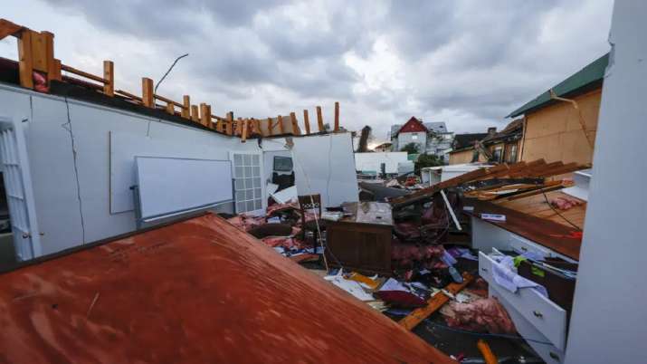 India Tv - Debris spreads across a local business that was destroyed by the tornado that tore through the city of Selma Ala. 