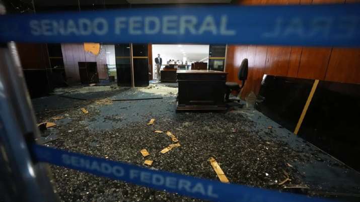 India Tv - 
The Senate president's office entrance is destroyed the day after Congress was stormed by supporters of former Brazilian President Jair Bolsonaro in Brasilia.