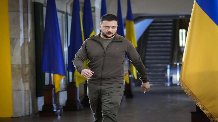 India Tv - Ukrainian President Volodymyr Zelenskyy walks ahead of a press conference in a city subway under a central square in Kyiv.