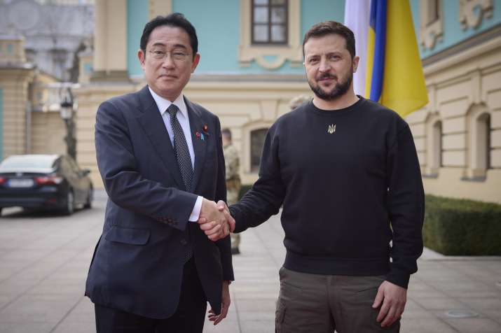 India Tv - Japanese Prime Minister Fumio Kishida and Ukrainian President Volodymyr Zelenskyy, right, greet each other during their meeting in Kyiv, Ukraine.