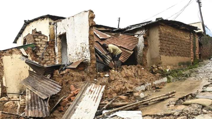 India Tv - A man checks the damage to his home, destroyed following heavy rains caused by Cyclone Freddy. 