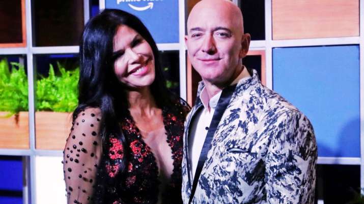 India Tv - Amazon Executive Chairman Jeff Bezos, right, and his girlfriend Lauren Sanchez pose for photographs during a blue carpet event organized by Amazon Prime Video in Mumbai.