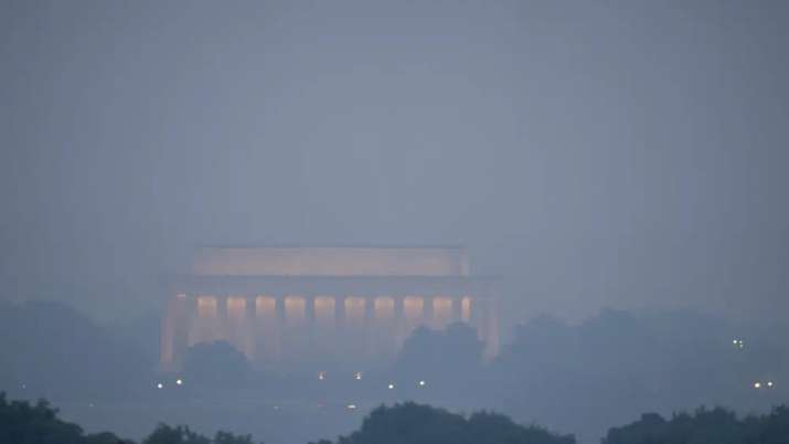 India Tv - Haze blankets the Lincoln Memorial on the National Mall in Washington as seen from Arlington, Va.