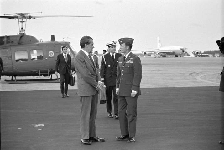India Tv - In this photo obtained by the National Security Archive from the Richard M. Nixon Presidential Library, Nixon speaks with senior Air Force officers, with Presidential Emergency Satchel carrier Lt. Commander T. Stephen Todd in the immediate background