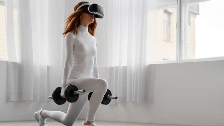 India Tv - Woman exercising using VR headset