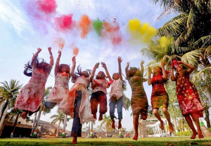India Tv - Bhopal: Young women play Holi in Bhopal, Friday