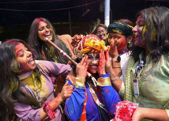 India Tv - Students of Patna Womens College play with colours during celebrations of Holi festival
