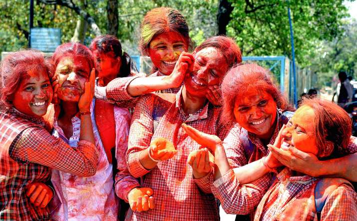 India Tv - Bhopal: Students celebrate the festival of Holi with colours, in Bhopal, Saturday, March 23, 2024. (