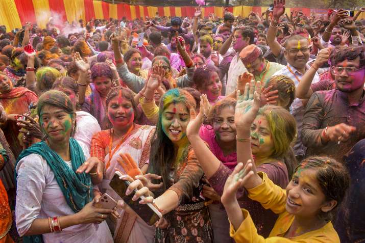India Tv - Gorakhpur: People play with colours during Holi celebrations, in Gorakhpur, Sunday