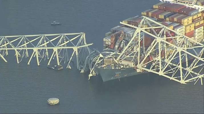India Tv - Parts of Francis Scott Key Bridge remain after container ship collided with one of the bridge in Bal