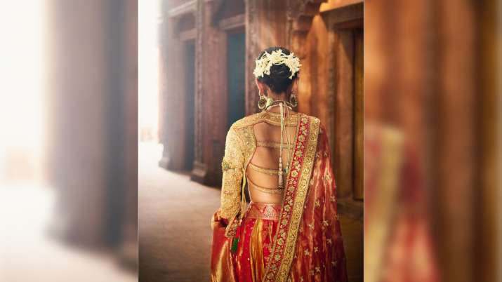 India Tv - Radhika Merchant's red vidai lehenga